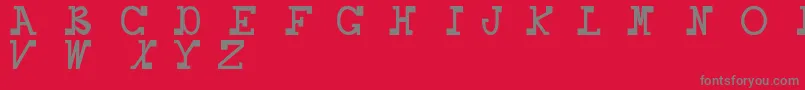Daboss-fontti – harmaat kirjasimet punaisella taustalla