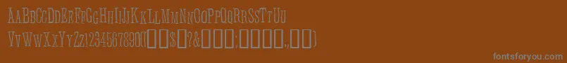 Anhedoni-fontti – harmaat kirjasimet ruskealla taustalla