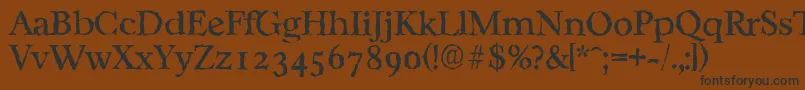 フォントCasablancarandomRegular – 黒い文字が茶色の背景にあります