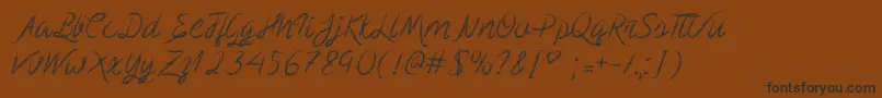 フォントScribbleScript – 黒い文字が茶色の背景にあります