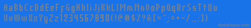 フォントAuxDotbitcCond – 青い背景に灰色の文字