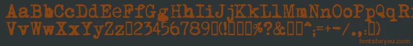 MomsTypewriter-fontti – ruskeat fontit mustalla taustalla