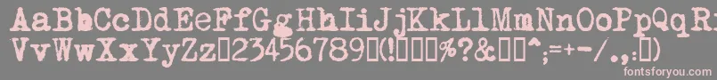 MomsTypewriter-fontti – vaaleanpunaiset fontit harmaalla taustalla
