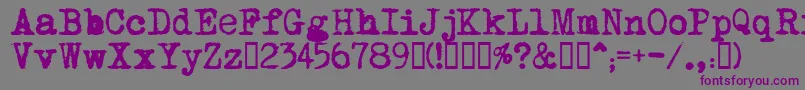MomsTypewriter-fontti – violetit fontit harmaalla taustalla