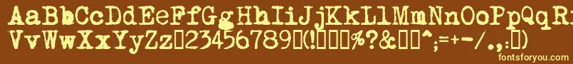 MomsTypewriter-fontti – keltaiset fontit ruskealla taustalla