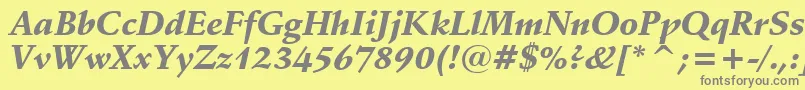 フォントSchneidlerBlackItalicBt – 黄色の背景に灰色の文字