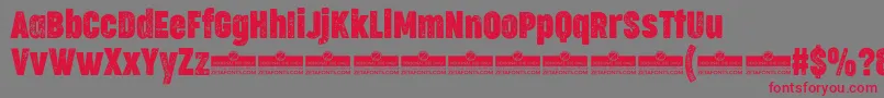 CocogooseCompressedLetterpressTrial-Schriftart – Rote Schriften auf grauem Hintergrund