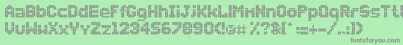 Dollydots Font – Gray Fonts on Green Background