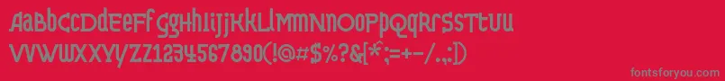 フォントDvekruglyhc – 赤い背景に灰色の文字