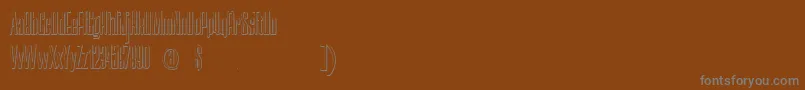 Czcionka NerettaBeveled – szare czcionki na brązowym tle