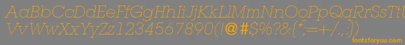 フォントL850SlabLightItalic – オレンジの文字は灰色の背景にあります。