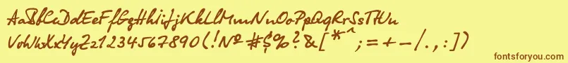 フォントOlga – 茶色の文字が黄色の背景にあります。