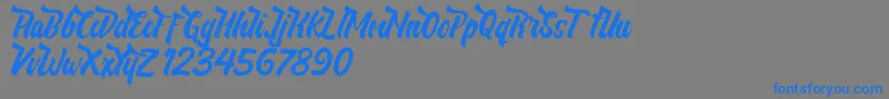 NeldaFree-Schriftart – Blaue Schriften auf grauem Hintergrund