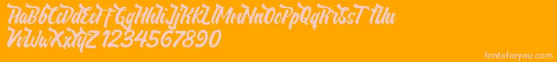 NeldaFree-Schriftart – Rosa Schriften auf orangefarbenem Hintergrund