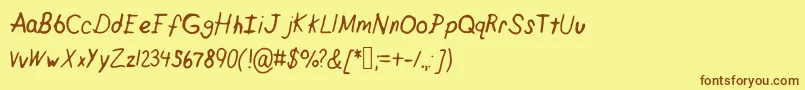 フォントCrappypeanuts – 茶色の文字が黄色の背景にあります。