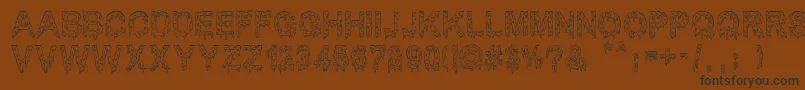 フォントMisterMuerte – 黒い文字が茶色の背景にあります