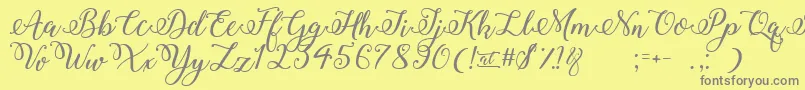 Fonte WinterCalligraphy – fontes cinzas em um fundo amarelo