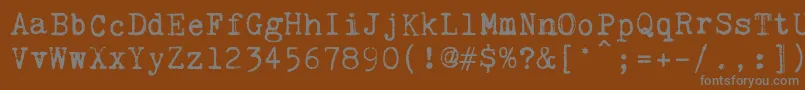 Шрифт KingthingsTrypewriter2 – серые шрифты на коричневом фоне