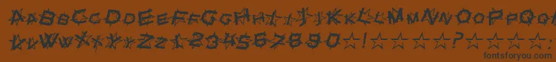 フォントStarDustItalic – 黒い文字が茶色の背景にあります