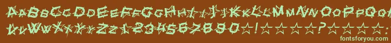 フォントStarDustItalic – 緑色の文字が茶色の背景にあります。
