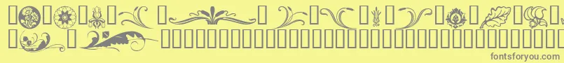 Florals-fontti – harmaat kirjasimet keltaisella taustalla