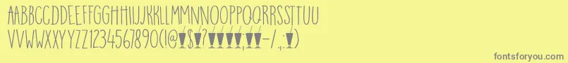 DkMangoSmoothie-Schriftart – Graue Schriften auf gelbem Hintergrund