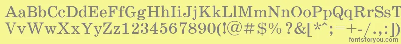 Schoolbookac-fontti – harmaat kirjasimet keltaisella taustalla