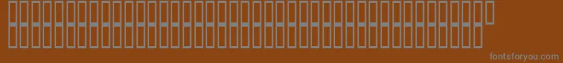 ArchieVisionBold-fontti – harmaat kirjasimet ruskealla taustalla