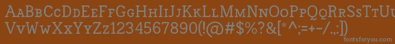 FrontenacSmallcaps-fontti – harmaat kirjasimet ruskealla taustalla