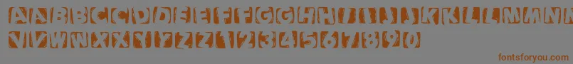 Woodcuttedcapsinvers Font – Brown Fonts on Gray Background