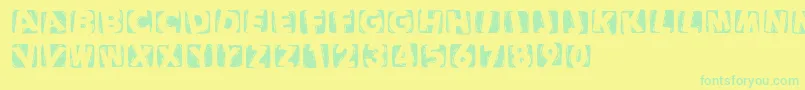 Czcionka Woodcuttedcapsinvers – zielone czcionki na żółtym tle