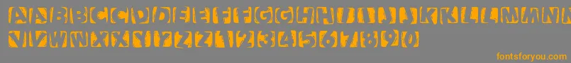 Woodcuttedcapsinvers-Schriftart – Orangefarbene Schriften auf grauem Hintergrund