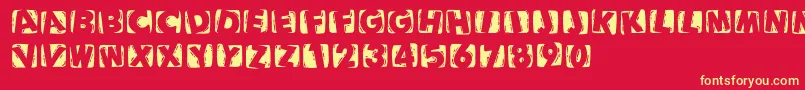 Woodcuttedcapsinvers Font – Yellow Fonts on Red Background