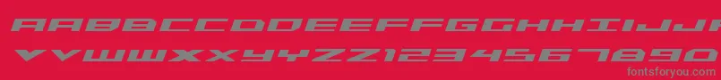 Czcionka TriremeBoldItalic – szare czcionki na czerwonym tle