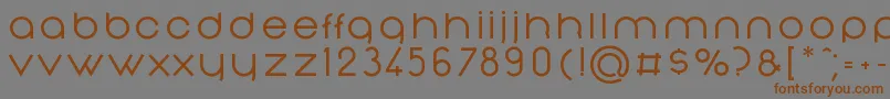 フォントNonchalanceMedium – 茶色の文字が灰色の背景にあります。