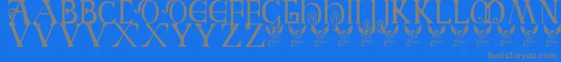 Fonte Britishblockflourish – fontes cinzas em um fundo azul