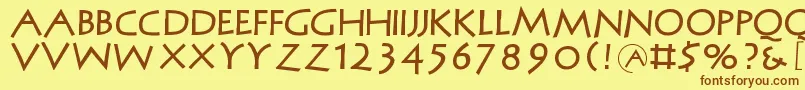 フォントMcapitals – 茶色の文字が黄色の背景にあります。