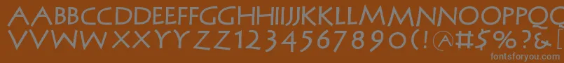 フォントMcapitals – 茶色の背景に灰色の文字