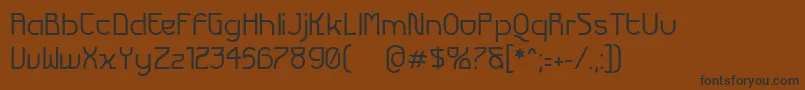 フォントFuturexVariationAlpha – 黒い文字が茶色の背景にあります
