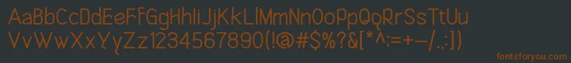 Шрифт ClicheRegular – коричневые шрифты на чёрном фоне