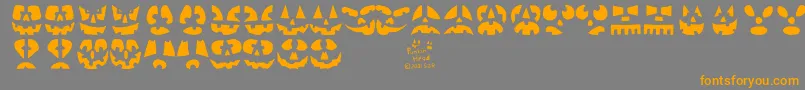 Punkinhead-Schriftart – Orangefarbene Schriften auf grauem Hintergrund