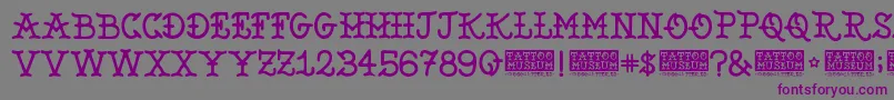 Шрифт TattooMuseum – фиолетовые шрифты на сером фоне