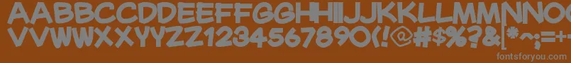 MaurysselBold-fontti – harmaat kirjasimet ruskealla taustalla