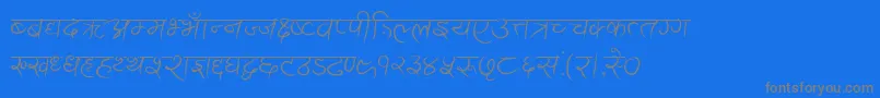 フォントAnandaAkchyar – 青い背景に灰色の文字