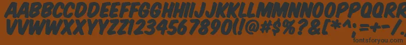 KomikaTitlePaint Font – Black Fonts on Brown Background