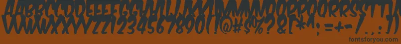 fuente Komikabg – Fuentes Negras Sobre Fondo Marrón