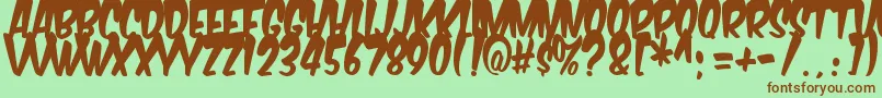 Fonte Komikabg – fontes marrons em um fundo verde