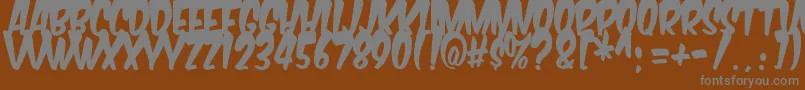 Komikabg Font – Gray Fonts on Brown Background