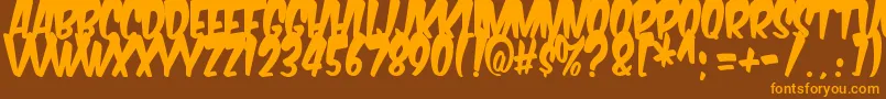 フォントKomikabg – オレンジ色の文字が茶色の背景にあります。