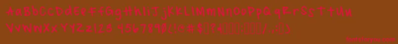 MacadyRegular Font – Red Fonts on Brown Background